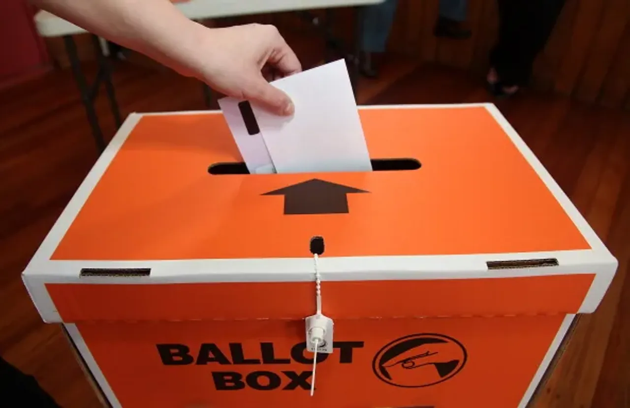WELLINGTON, NEW ZEALAND, NOVEMBER 20: A voter places a ballot paper into the ballot box during the Mana By-Election at Cannons Creek School polling booth on November 20, 2010 in Wellington, New Zealand. The Mana seat was vacated by former Labour Pacific Island Affairs Minister Winnie Laban, who…